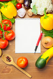 Organic Vegetables on Wooden Table and Notebook 