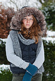Girl in winter cloths and fur hood