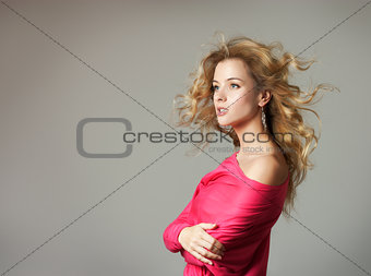 Woman in Pink Blouse on Gray Background