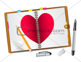 open diary with a red heart 