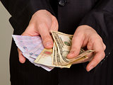 businessman in a suit holding a money 