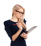 Smiling business woman writing on clipboard