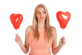 Young woman choosing one of balloons