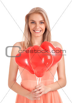Young woman with heart shape balloons