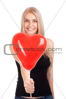 Young woman with heart shape balloon
