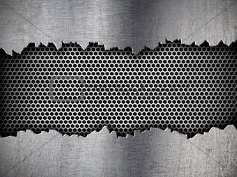 silver hexagon metal grate background in ripped hole
