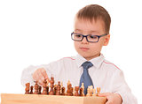 Serious child playing chess