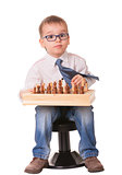 Serious child playing chess
