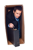 Businessman inside of a cardboard box