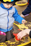 Boy Playing in Sandbox