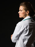 Portrait of confident medical doctor woman looking on copy space
