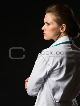 Portrait of confident medical doctor woman looking on copy space