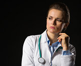 Portrait of thoughtful medical doctor woman looking on copy spac