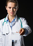 Closeup on medical doctor woman giving prescription isolated on 