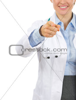 Closeup on medical doctor woman pointing in camera