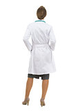 Full length portrait of medical doctor woman. Rear view