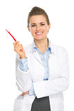 Happy medical doctor woman holding toothbrush