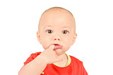 Baby boyin red shirt  sucking on his finger