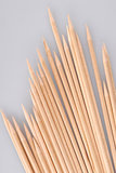 Multiple wooden bamboo skewers laying
