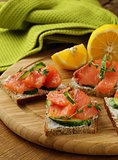 canape sandwiches with salmon and cucumber