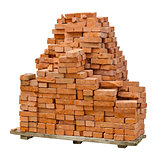 Stack of red clay bricks on white background