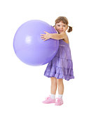 Little girl with a big purple ball