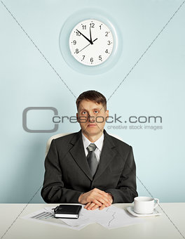 Businessman waiting in an office at the workplace