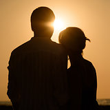 Sillhouette of loving couple at sunset