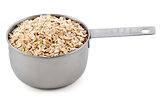 Porridge oats presented in an American metal cup measure