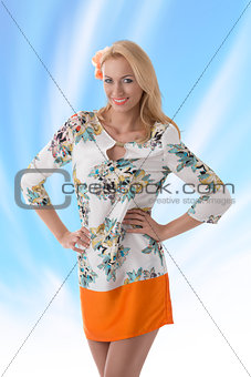 blonde clothing dress with floral pattern she smiles