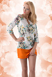 blonde clothing dress with floral pattern and hand on the hip