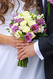 Couple with wedding bouquet