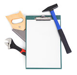 Work tools and clipboard on white