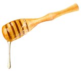 drop honey on wooden dipper