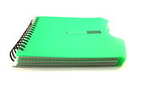green notebook on white background