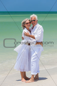 Happy Senior Couple Embracing on Tropical Beach