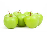 seven green apples isolated on a white background 