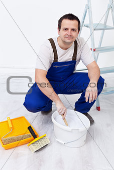 Worker preparing the paint