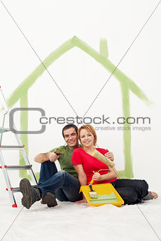 Couple with painting utensils resting