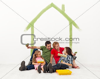 Family repainting their home concept