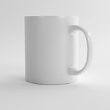 white clean ceramic mug on a light background