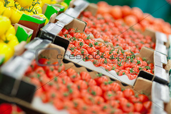tomatoes on the shelf in the supermarket