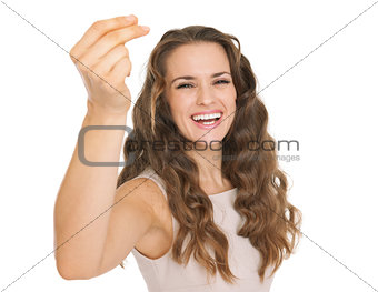 Happy young woman snapping fingers