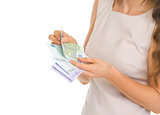 Closeup on woman counting euros