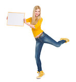 Full length portrait of happy student girl showing blank board