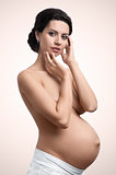 Beautiful figure of young pregnant woman