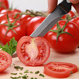 Preparing food: sliced tomato