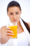 Woman holding glass of fresh orange juice