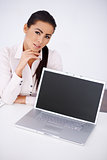 Business woman sitting at her desk with laptop