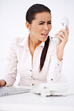 Woman yelling on somebody over telephone